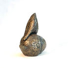 Bronze resin sculpture of a bird on an acorn by Caro Burberry.