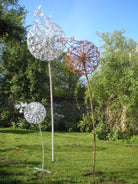 Steel garden sculptures of dandelion clocks by Designs on Metal