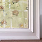 Frame detail of oil painting of birds on floral vase arrangement by Belynda Sharples