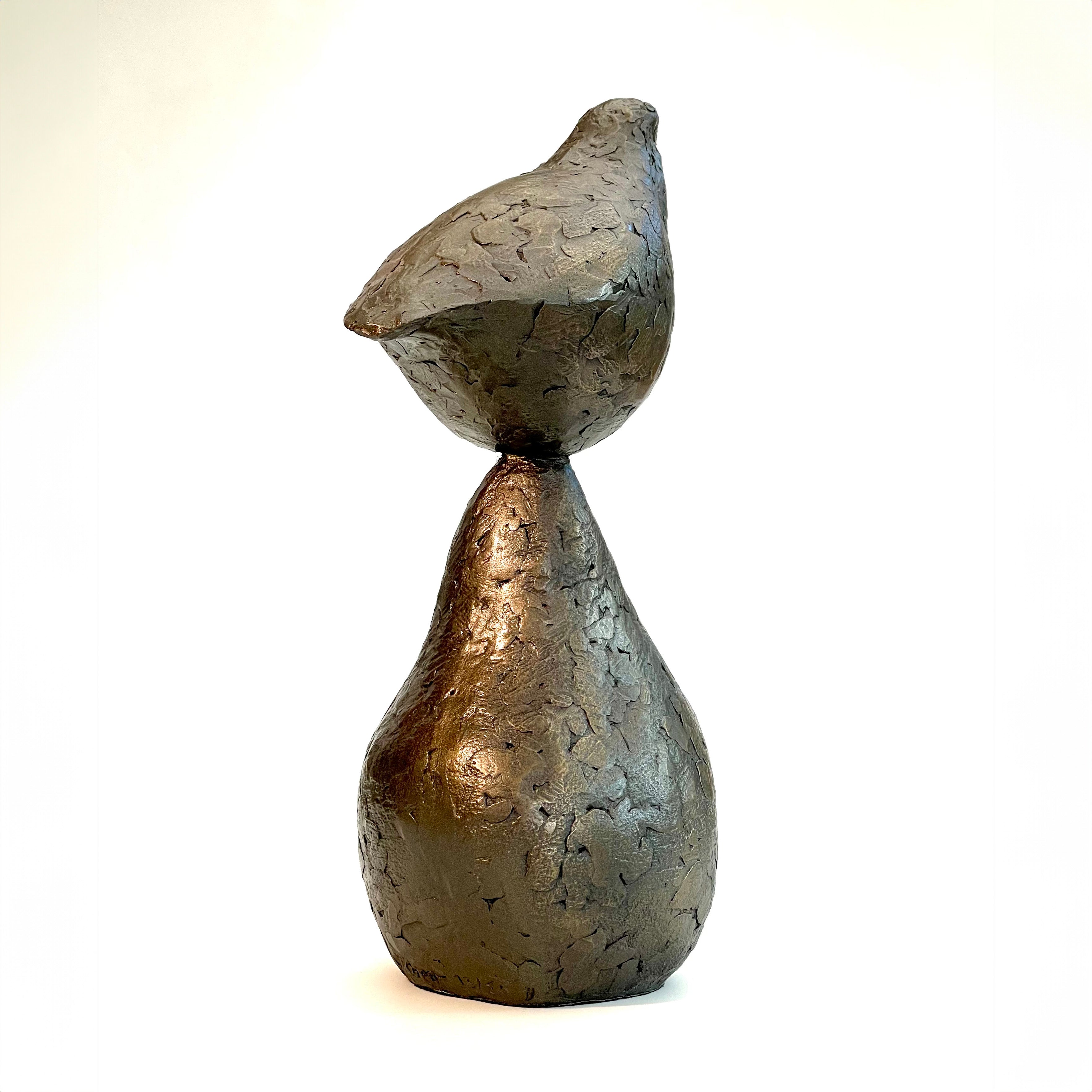Small bronze sculpture of bird sitting on pear by Caro Burberry