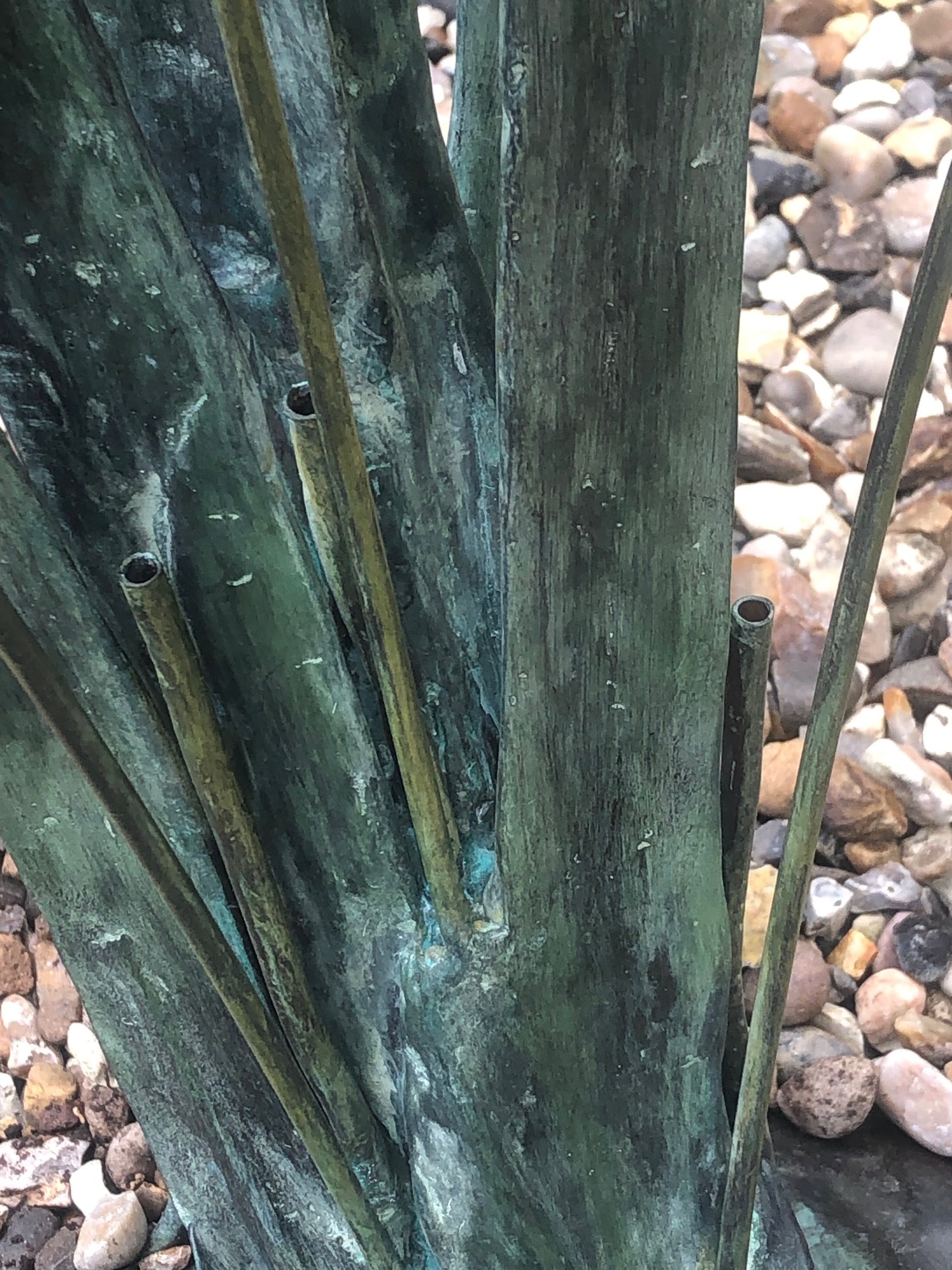 Close up of water feature on garden sculpture of ducks in flight by John Cox