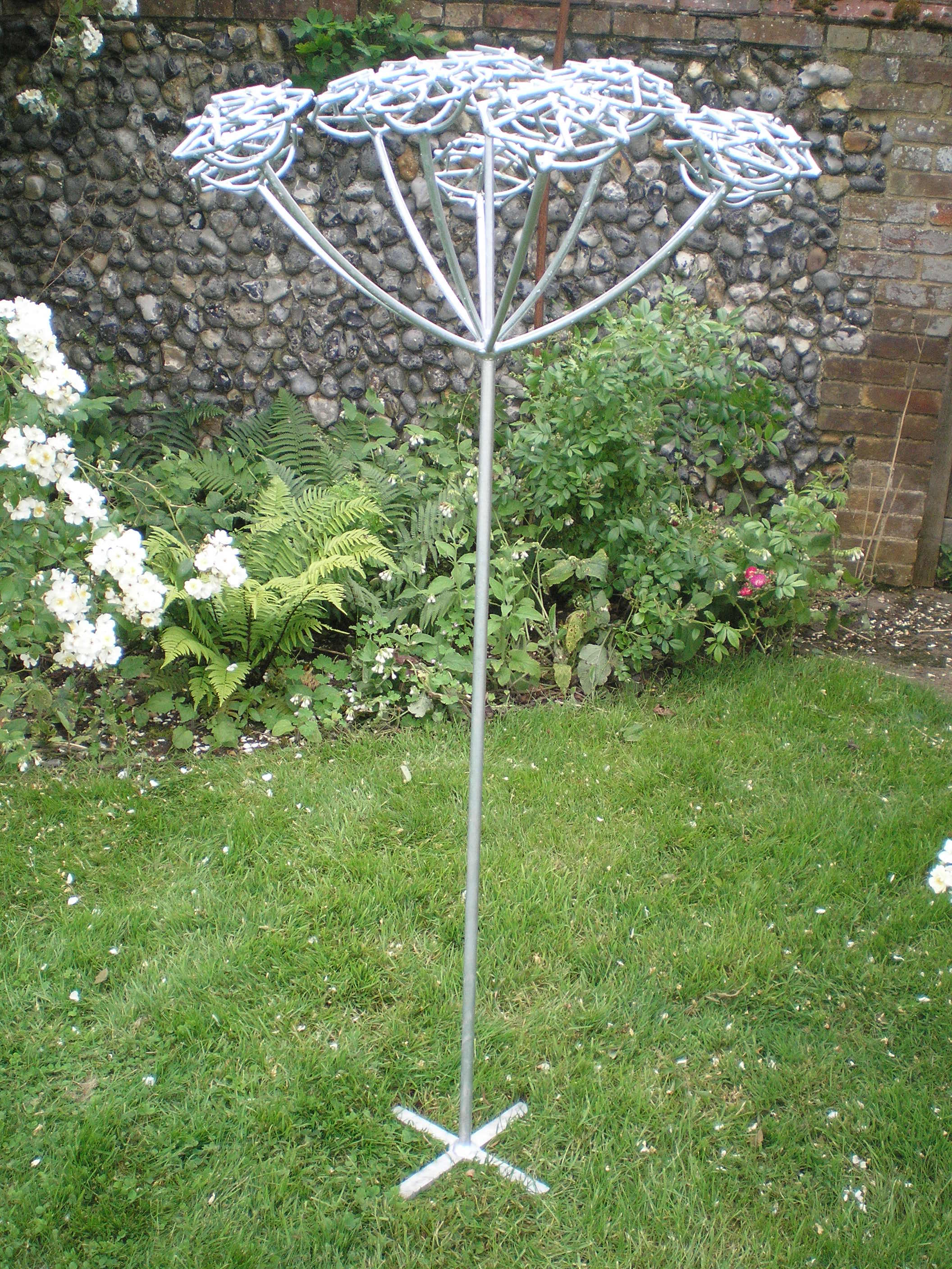 Steel garden sculpture of hemlock plant by Designs on Metal