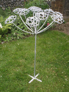 Steel garden sculpture of hemlock plant by Designs on Metal