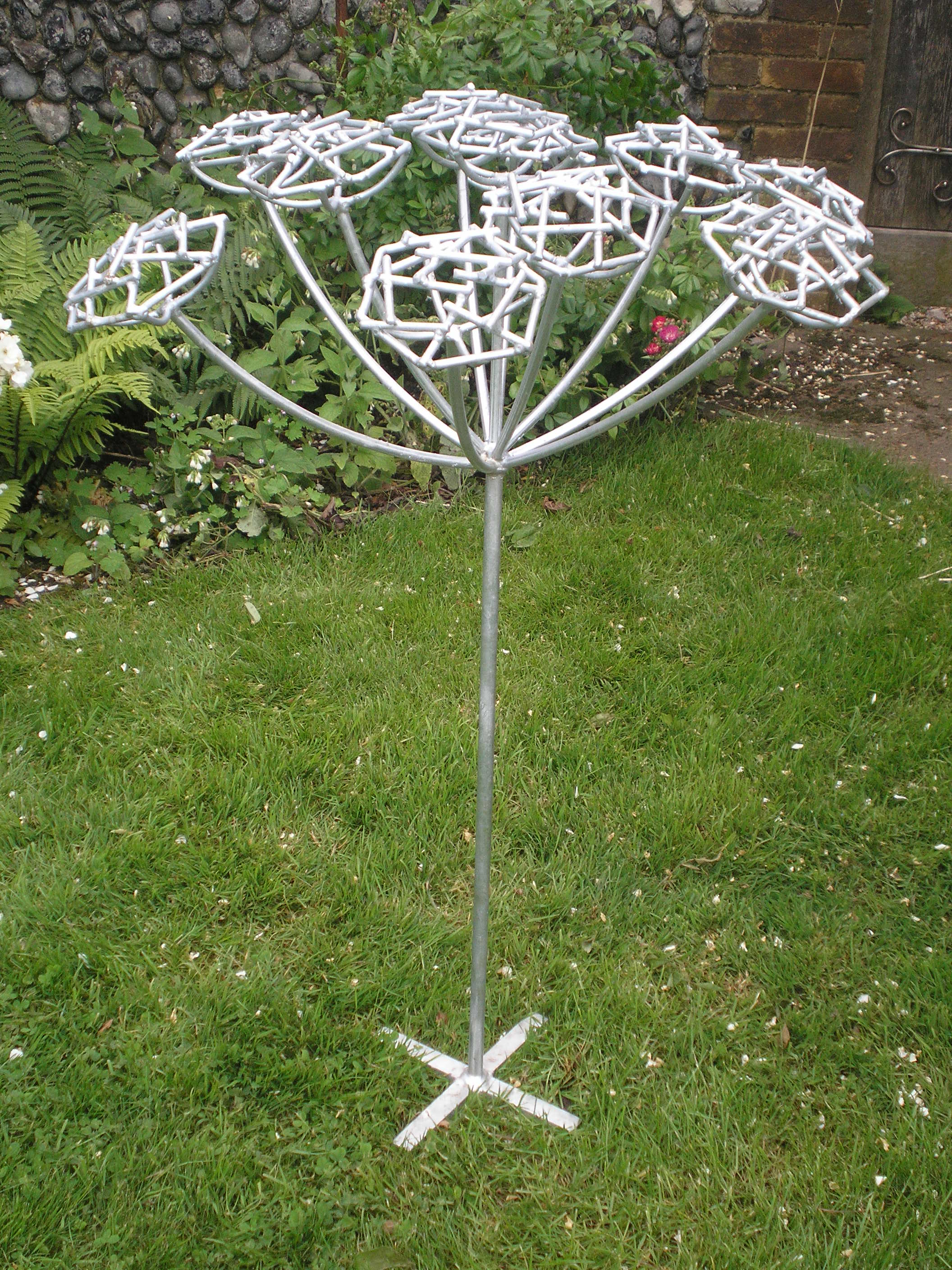Steel garden sculpture of hemlock plant by Designs on Metal