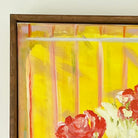 Framed detail of floral table scape in yellow and orange with decorative vases by Belynda Sharples