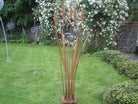 Garden sculpture of bulrush plant in rusting steel by Designs on Metal.
