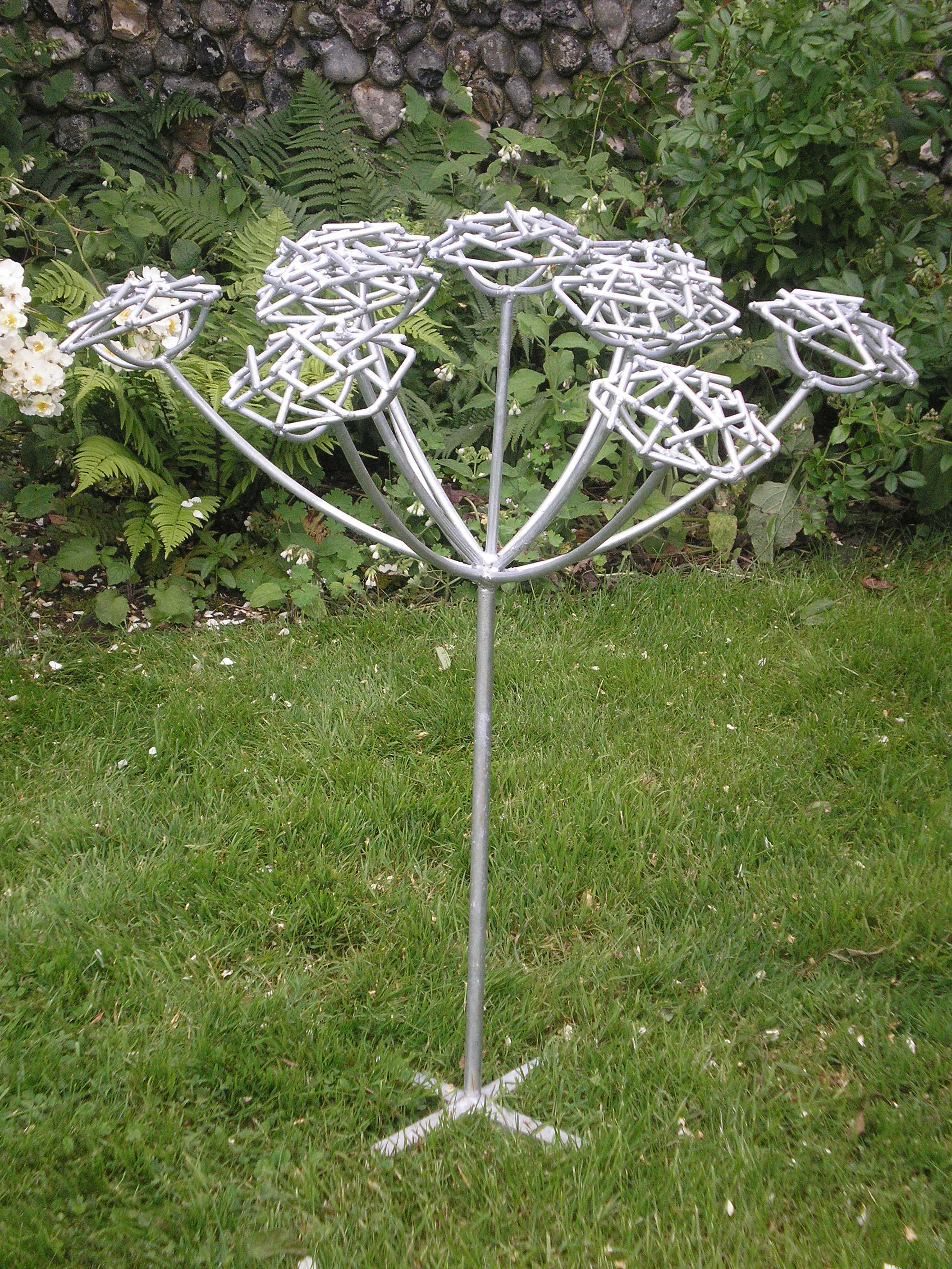 Steel garden sculpture of hemlock plant by Designs on Metal
