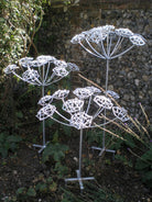 Steel garden sculpture of hemlock plant by Designs on Metal
