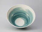 Tall porcelain bowl in white with blue wash on the inside edge by Ali Tomlin