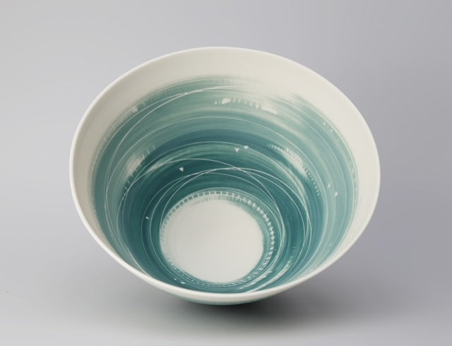 Tall porcelain bowl in white with blue wash on the inside edge by Ali Tomlin