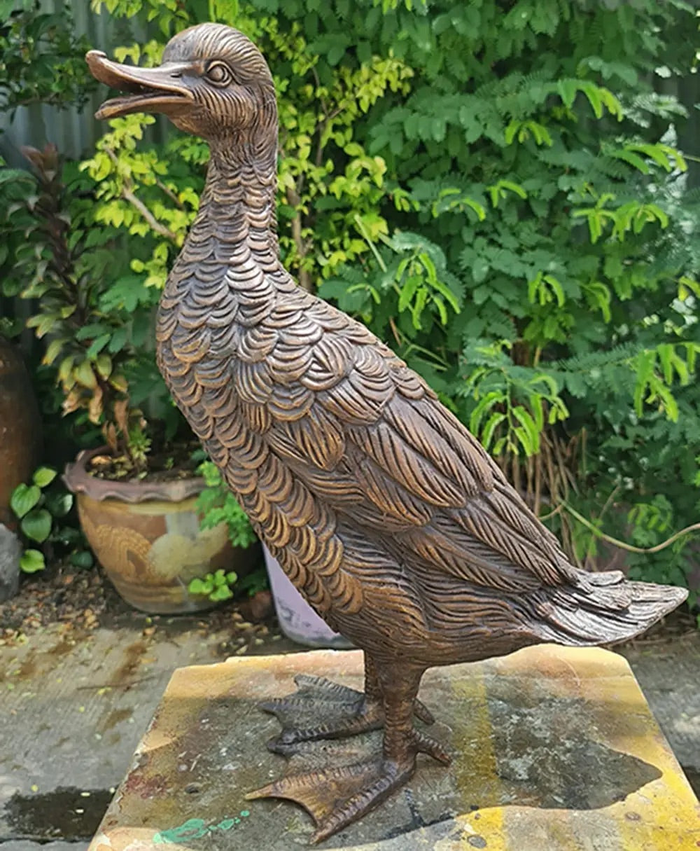 Garden sculpture of bronze cast duck by John Cox.