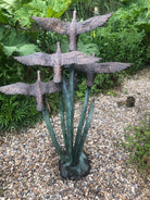 Garden sculpture of ducks in flight by John Cox