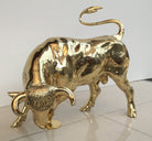 Polished bronze sculpture of fighting bull by John Cox