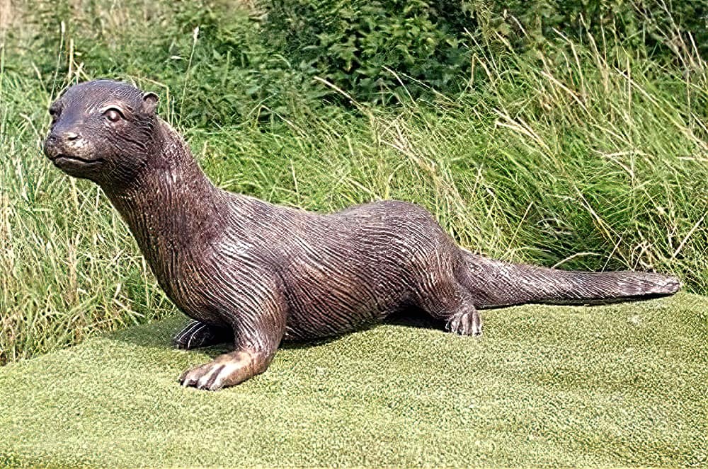 Garden sculpture of an otter in bronze by John Cox