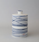Lidded pot. Blue lines